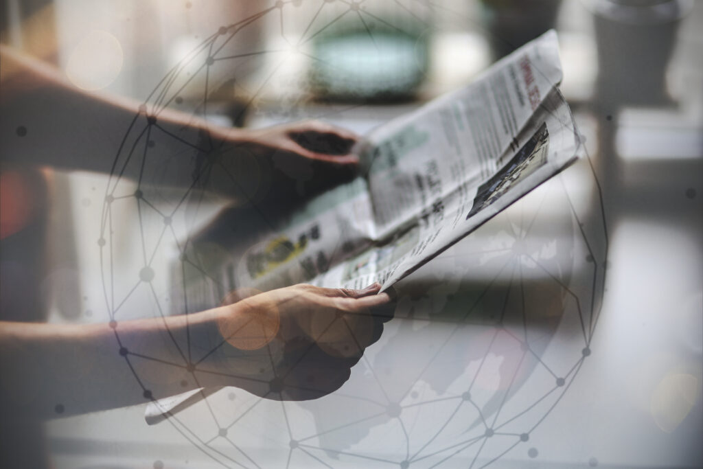 person reading a newspaper